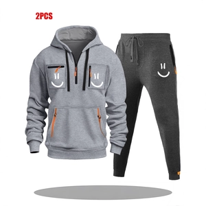 Men's grey two-piece hoodie set with orange zippers and white smiley face print