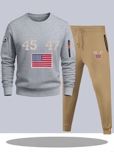 Detail of grey sweatshirt and khaki joggers featuring zip pockets and number embroidery