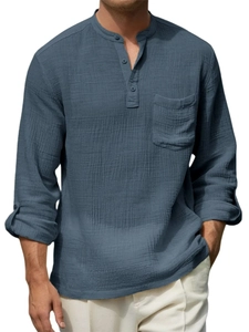 Close-up of waffle texture fabric on men's long sleeve henley shirt in soft blue
