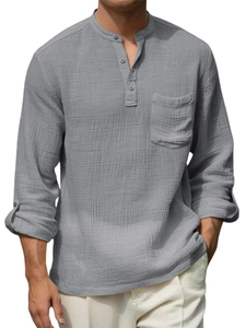 Detail of grey cotton linen long sleeve shirt featuring a pocket and textured fabric