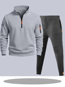 Ensemble sweat à capuche gris clair et jogging gris foncé avec zip orange vif