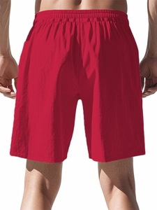Rear view of men's red hip-hop sports shorts featuring elastic waist and breathable fabric