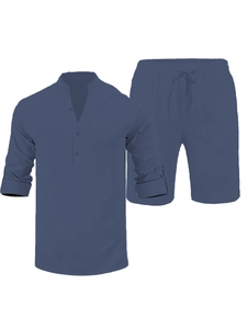 Detail of blue linen texture on men's long sleeve henley shirt and drawstring shorts