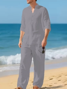 Detail of grey linen-style men's casual two-piece set featuring three-button henley collar