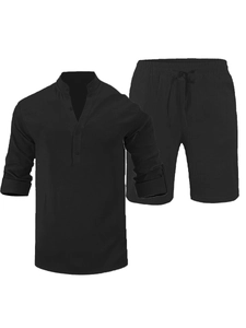 Detail view of black linen shirt with henley collar and drawstring waist shorts