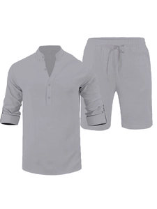 Detailed view of grey linen blend set featuring Henley collar and drawstring shorts texture