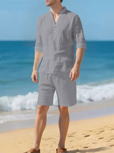 Detail of grey linen texture on a men's summer henley shirt and shorts beach set