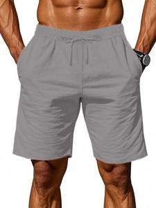 Detail view of men's casual cotton linen shorts showing drawstring waist and grey texture