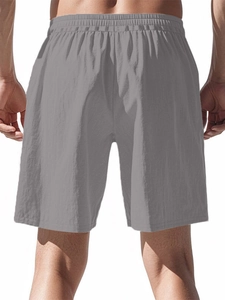 Rear view of men's casual grey sports shorts showing elastic waistband and fabric texture