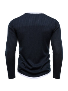 Detailed back view of navy blue ribbed knit sweater with white layered effect accents