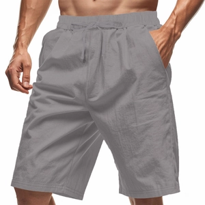 Detail of grey men's linen shorts showing elastic drawstring waist and side pockets