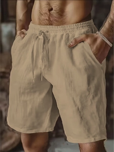 Detail of khaki men's breathable linen shorts featuring elastic waistband and drawstring