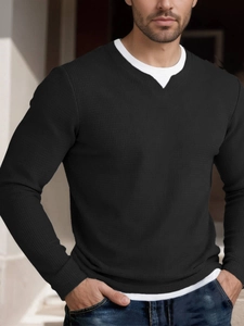 Detail of black waffle knit long sleeve t-shirt with layered faux two-piece collar