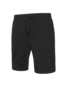 Detail of men's black linen shorts showing elastic waistband and drawstring with metal tips