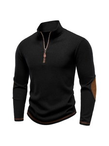 Detail view of men's quarter-zip knit sweater showing ribbed texture and elbow patches
