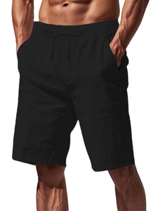 Detail of men's breathable cotton linen shorts featuring elastic drawstring waistband