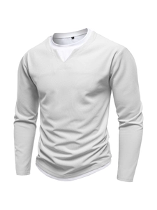 Close-up of light grey waffle knit texture on men's long sleeve layered crewneck shirt