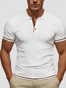 Close-up of white ribbed polo shirt featuring brown button placket and trim details