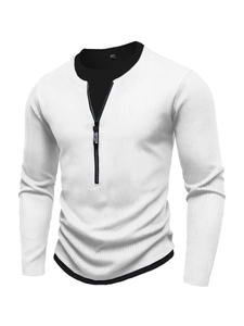 Detail of white rib-knit sweater featuring faux-two-piece layers and sporting zipper