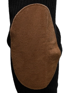 Detailed close-up of a black knit sweater featuring a brown faux suede elbow patch design
