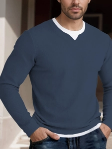Detail of navy blue waffle knit fabric and layered double collar design on men's long sleeve tee