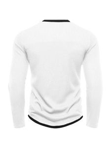 Close-up of white rib-knit men sweater showing black contrast trim and vertical texture