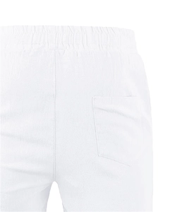 Detail of white cotton linen shorts featuring elastic waistband and back patch pocket