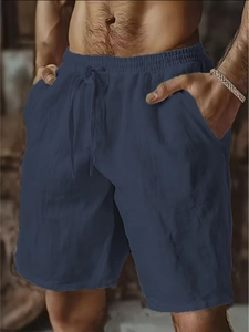 Detail of navy cotton linen shorts featuring elastic drawstring waist and side pockets