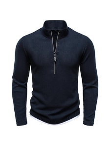Detailed view of navy blue ribbed knit texture and sporting half-zip stand-up collar design