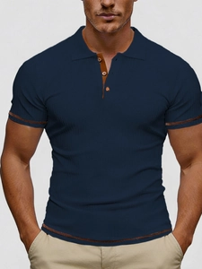 Detail view of navy polo shirt with brown contrast lining and rib-knit texture