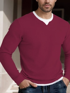 Detail view of burgundy waffle knit texture and layered double-collar design on a men's top