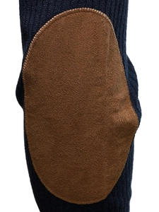 Detail of dark blue knit sweatshirt showing brown suede elbow patch with fine stitching