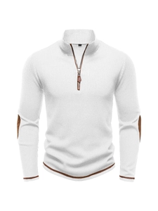 Detail of white ribbed sweater featuring 1/4 zipper with leather pull and elbow patches