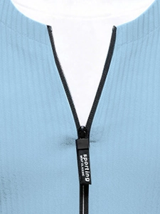 Macro detail of the light blue knit collar with sporting engraved metal zipper pull