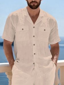 Detail of men's linen casual set with Cuban collar shirt and pocket on beach balcony
