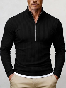 Detail of metal half-zipper collar and ribbed knit texture on men's black sweater