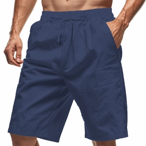 Close-up of men's dark blue cotton linen shorts featuring elastic waist and drawstring