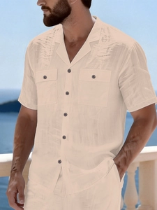 Close-up of beige men's linen beach shirt set with Cuban collar and dual chest pockets