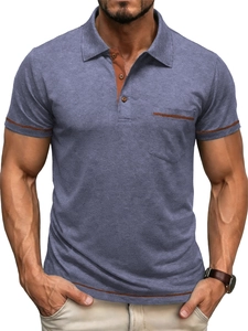 Close-up of men's polo shirt featuring blue textured fabric and orange contrast trim