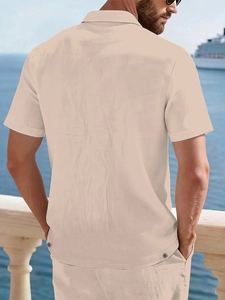 Detailed texture of men's linen beach shirt with button accents and breathable summer fabric