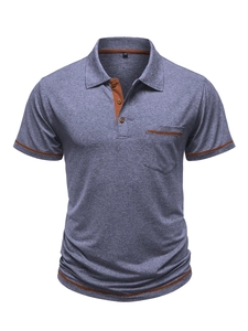Detail view of heather grey polo shirt with orange contrast trim and chest pocket