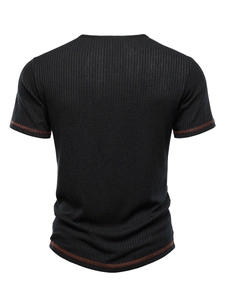 Detailed back view of black ribbed knit t-shirt with brown contrast stitching accents