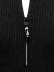Detail of a black ribbed knit sweater featuring a silver metal zipper and sports pull tab