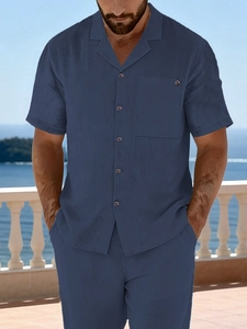 Detail view of navy blue linen blend short sleeve shirt with Cuban collar and chest pocket