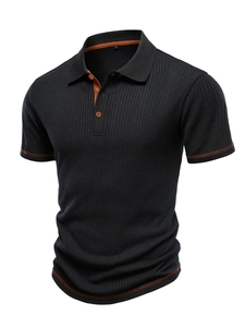 Detail of black vertical striped polo shirt with orange contrast stitching and button collar