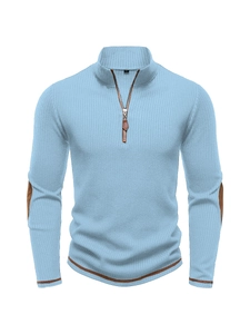 Detail view of light blue ribbed knit sweater with leather pull and elbow patches