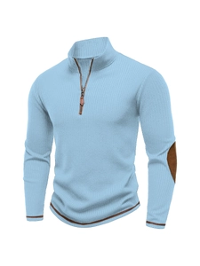 Detail of blue men's quarter-zip sweater with ribbed texture and brown elbow patches