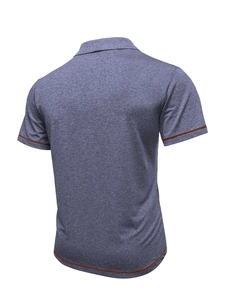 Detail view of men's heather grey polo shirt back with orange contrast stitching details
