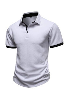 Detailed view of white knit polo shirt featuring vertical 3D texture and black contrast edges