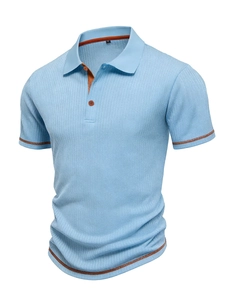 Detail of light blue ribbed polo shirt with contrast brown striped collar and cuffs